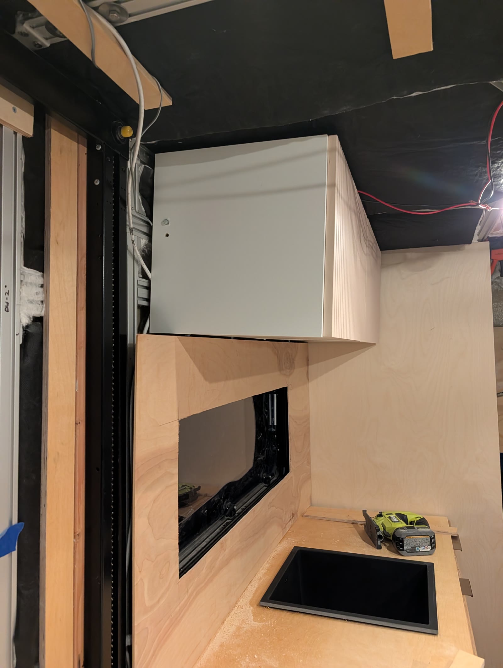 Overhead cabinet in the galley corner