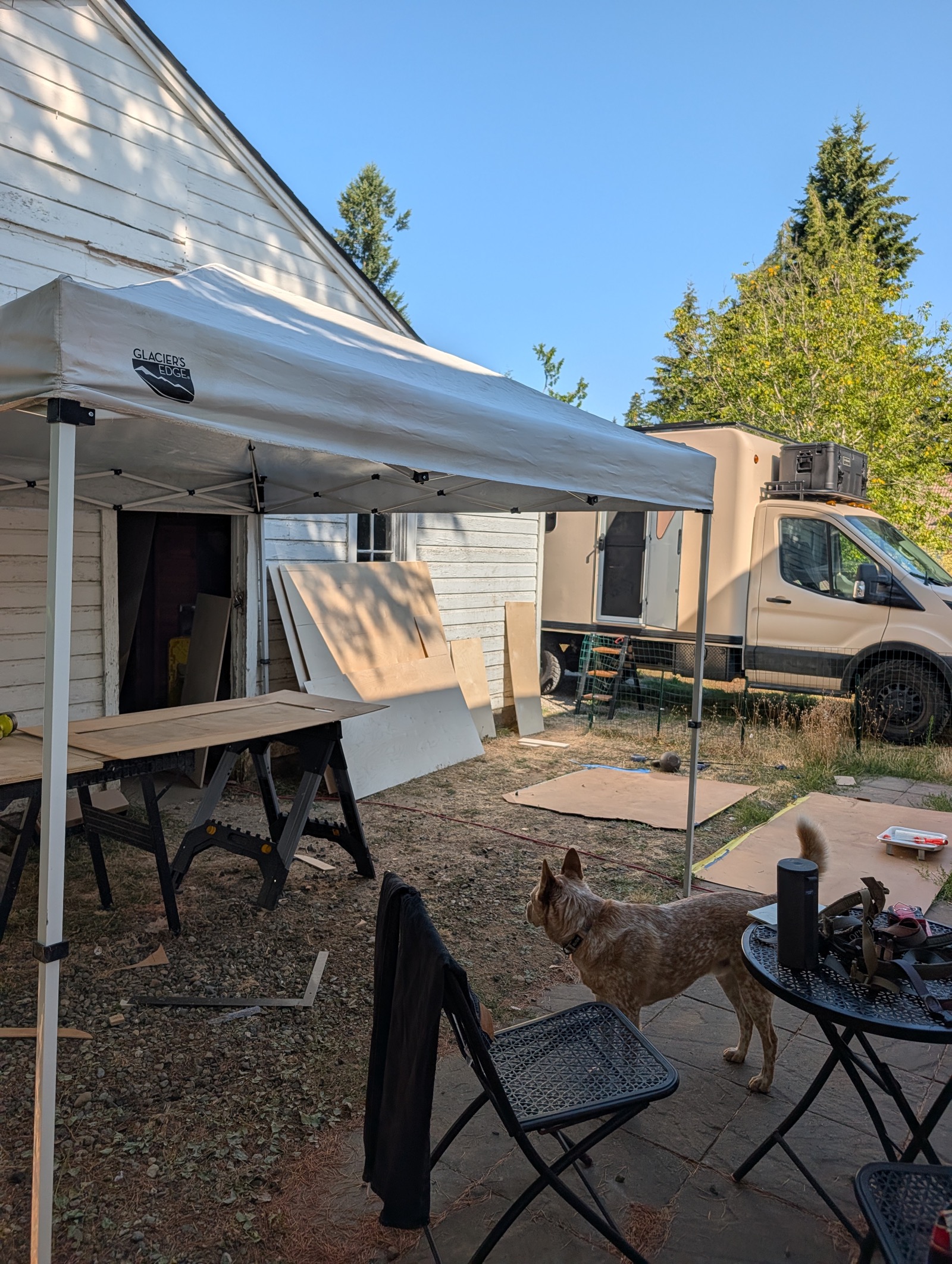 Outdoor cut station under a canopy, truck behind