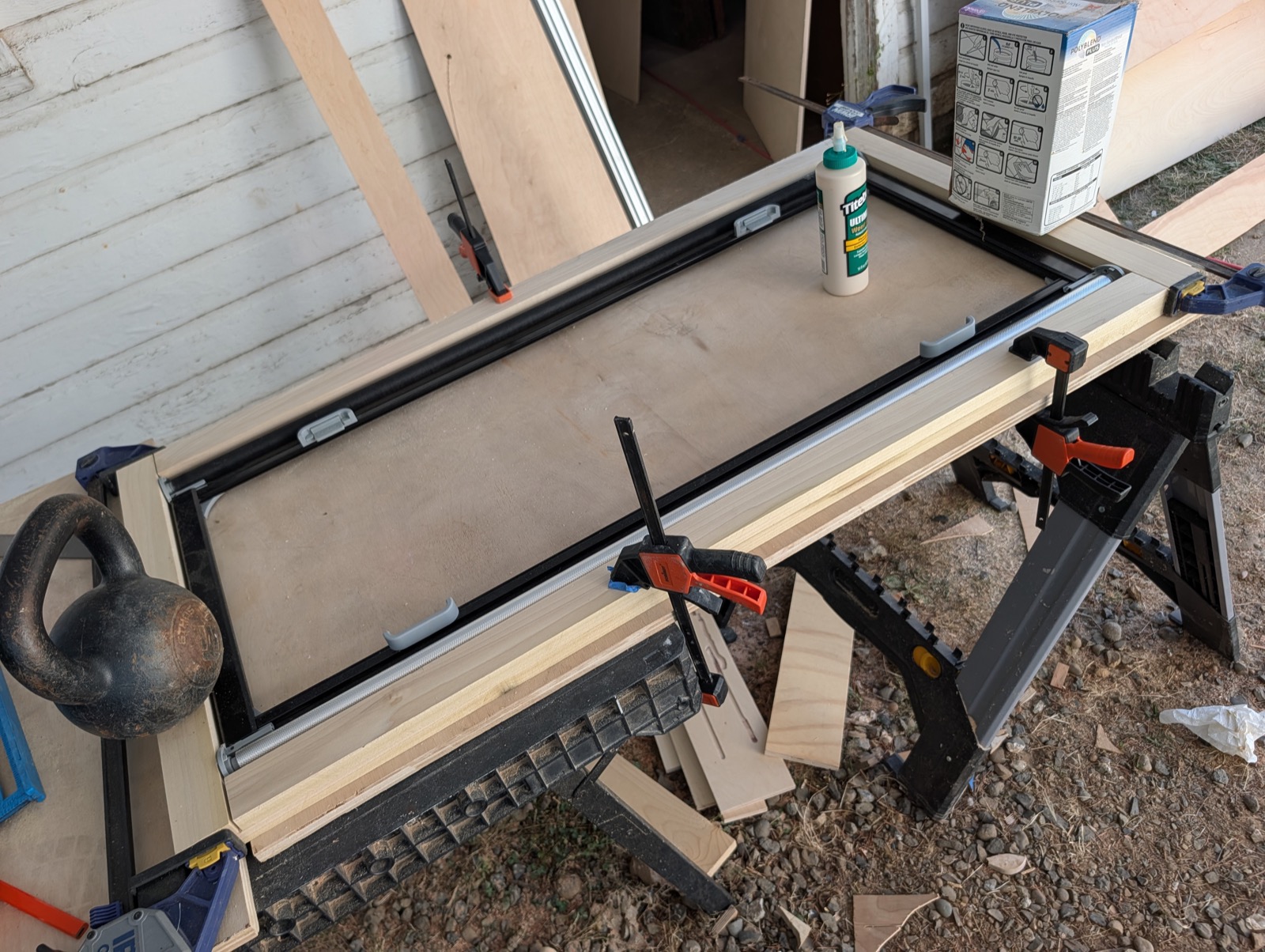 Frame glue-up clamped, kettlebell as a weight